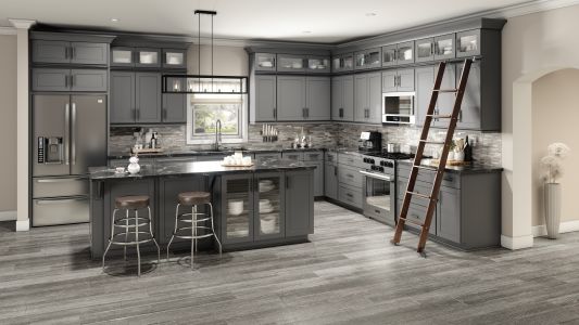 a kitchen with black cabinets that has been newly renovated